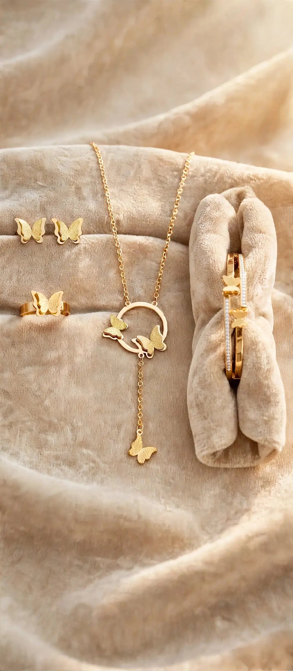 LUVORA Golden Butterfly Jewelry Set for Women – 4 Pcs Gold Plated Butterfly Necklace, Ring, Earrings and Bracelet on Beige Velvet