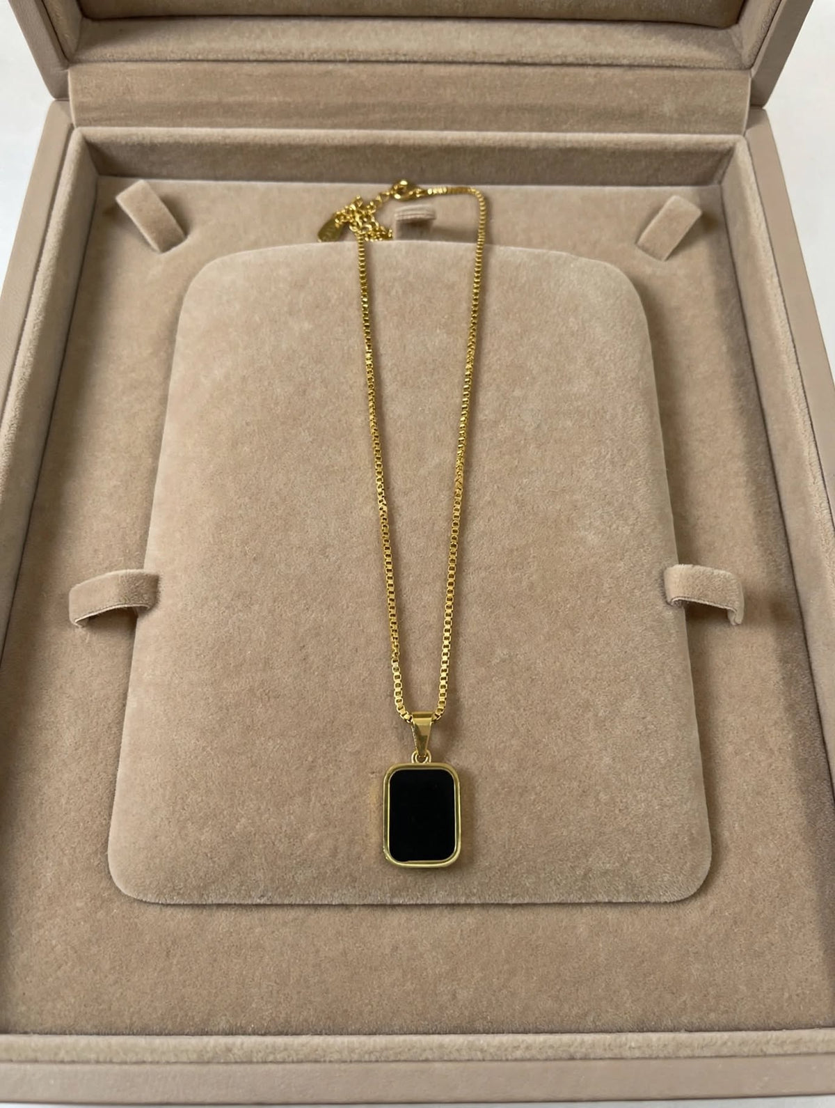 LUVORA 2-in-1 Reversible Pendant Necklace showing black onyx 