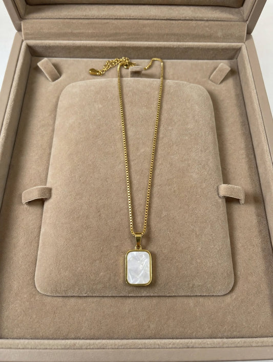 LUVORA 2-in-1 Reversible Pendant Necklace showing white mother of pearl side 